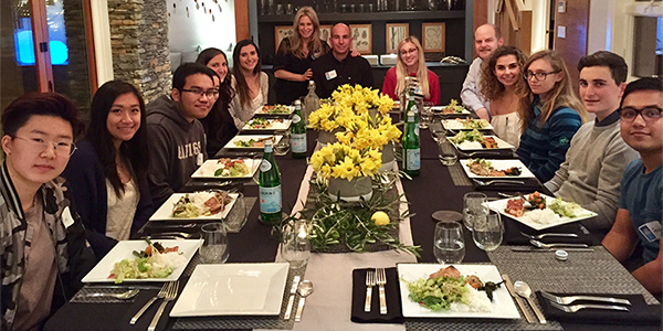 Students enjoying a dinner for 12 strangers